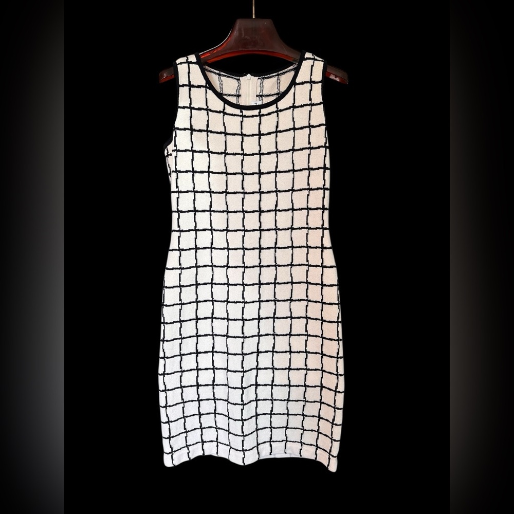 ST JOHN COLLECTION | Cream and black knit zipper back dress.
